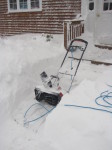 Electric Snow Blower having cleared a path through feet of snow