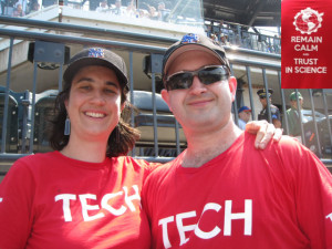 Alicia and Jonathan wearing Tech shirts that say Remain Calm and Trust in Science on the back