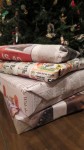 4 presents wrapped in newspapers