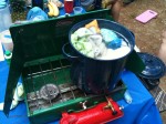 camping stove with a pot of boiling cloth diapers