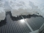 removing snow from solar panels